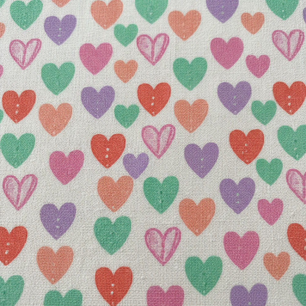 kare formatta kalp desen cotton kumaş görseli oluştur, kumaş renkleri soft ve canlı tonlar olsun